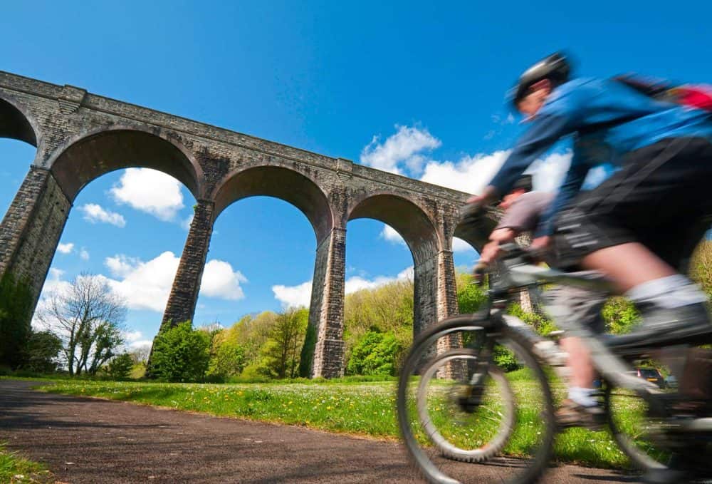 Cyclist in the foreground of Porthkerry viaduct